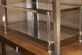 A gilt metal glass and lucite two tier coffee table W.111cm