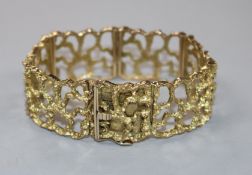An early 1970's pierced 9ct textured gold bracelet.