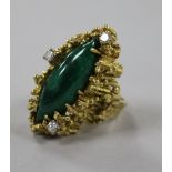 An early 1970's 18ct gold, diamond and malachite dress ring, of rustic form, size L.