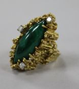 An early 1970's 18ct gold, diamond and malachite dress ring, of rustic form, size L.