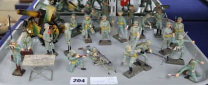A group of twenty four Lineol composition models of Swiss soldiers, in various attitudes,