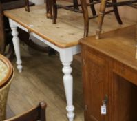 A pine farmhouse table with white painted base W.140cm