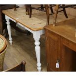 A pine farmhouse table with white painted base W.140cm