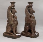 A pair of Castle Hedingham 'griffin' candlesticks height 34cm