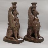 A pair of Castle Hedingham 'griffin' candlesticks height 34cm