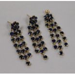 A pair of 14ct gold and multi drop sapphire earrings and matching pendant.