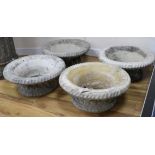 A set of four reconstituted stone basketry effect garden tubs W.54cm approx.