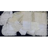 Various 19th century and later handmade lace trimmed hankies and a silk hankie sachet and baby
