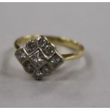 A yellow metal and diamond cluster ring, set with round and princess cut stones, size L.