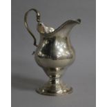 A George III silver inverted pear shaped cream jug, London, 1781, 12.3cm.