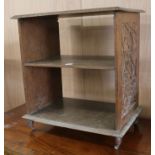 A carved walnut open bookshelf W.55cm