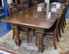 An extending dining table with four leaves W.265cm