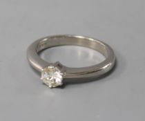 An 18ct white gold and solitaire diamond ring, size L.