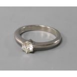 An 18ct white gold and solitaire diamond ring, size L.