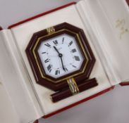 A Must de Cartier gilt metal and lacquer cased travelling quartz alarm clock, in fitted Must de