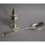 A George III silver sifter and a George III beaded Old English patter basting spoon.