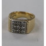 A textured 9ct gold and diamond set tablet ring, size P.