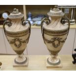 A pair of plaster urns height 57cm