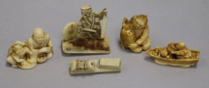 Three Japanese ivory netsukes and an okimono