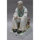 A Zsolnay ceramic figure of a gentleman, seated height 35cm