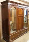 An Edwardian mahogany triple wardrobe W.196cm