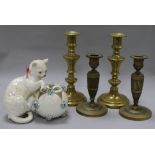 Two pairs of candlesticks and a porcelain model of a kitten with a basket candlesticks height 22cm