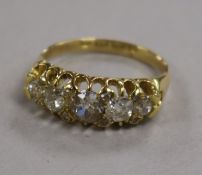 A late Victorian 18ct gold and graduated five stone diamond half hoop ring with rose cut diamond
