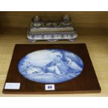 A Gien faience desk stand and a delft plaque