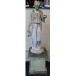 A reconstituted stone garden figure of Hebe holding a bowl and a jug, raised on square plinth W.