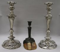 A pair of plated candlesticks and a camel hoof candlestick pair height 35cm