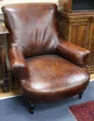 A pair of French leather club armchairs