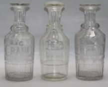 Three etched brandy decanters