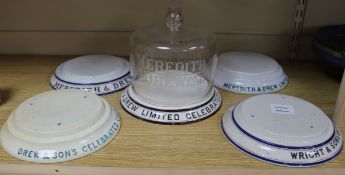 Five Meredith and Drew chocolate wafer stands, one with glass dome