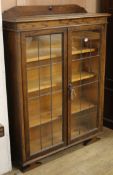 An Edwardian oak leaded bookcase W.94cm