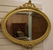 A gilt painted oval wall mirror W.88cm