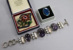 A silver, amethyst and paste set bracelet, a gilt metal and enamel brooch and a dress ring.