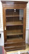 A mid 19th century French rosewood bookcase, enclosed by a glazed door, W.103cm