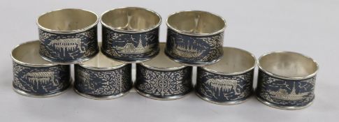A set of eight continental white metal and niello napkin rings.
