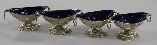 A set of four late Victorian silver boat shaped salts. Nathan & Hayes, Birmingham, 1893/6.