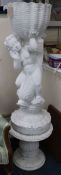 A plaster figure of a cherub and dolphin W.40cm approx.