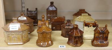 Thirteen Victorian glazed stoneware cottage money boxes