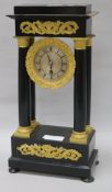 A portico clock and pendulum height 40.5cm
