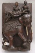 An Indian carved wood panel of an elephant length 50cm