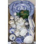 A quantity of blue and white Willow pattern teaware and a green square section case decanter