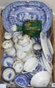 A quantity of blue and white Willow pattern teaware and a green square section case decanter