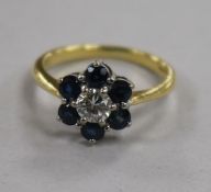 A modern 18ct gold, sapphire and diamond cluster ring, size Q.