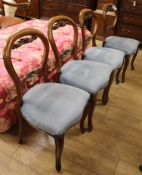 A set of four Victorian style balloon-back dining chairs