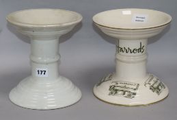 Two white glazed ceramic ham bone stands, one printed "Harrods"