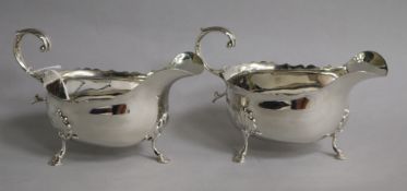 A pair of late Victorian silver sauceboats with flying scroll handles, Nathan & Hayes, Chester,