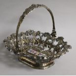 A 19th century Austro-Hungarian pierced white metal basket, the base with inset porcelain plaque,